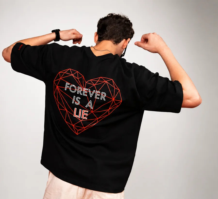 Forever Tee — wireframe heart back print on black, against a grey studio backdrop
