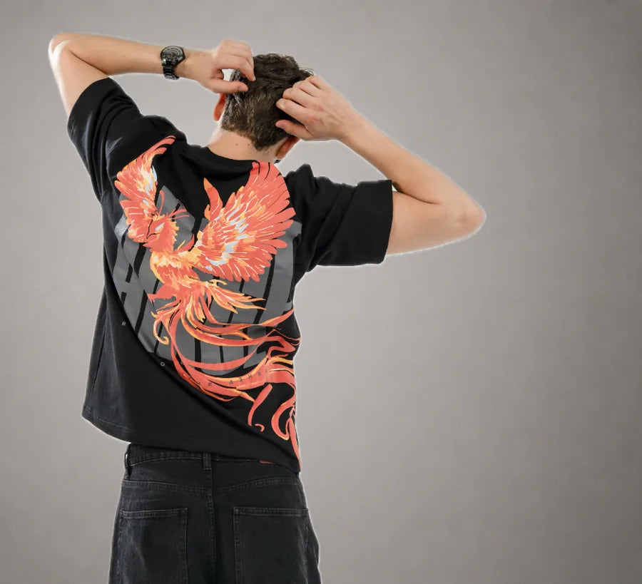 Phoenix Tee — flaming phoenix back print on black, against a grey studio backdrop